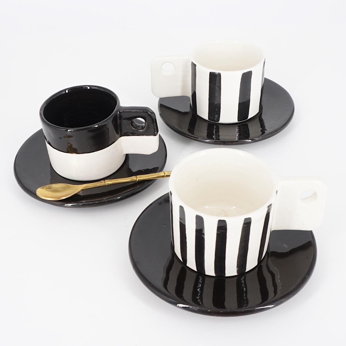 TAZZINA CAFFè CON PIATTINO MANICO BUCATO BICOLORE NERO TAZZINA CAFFÈ BUCO BICOLORE NERO NICOLE