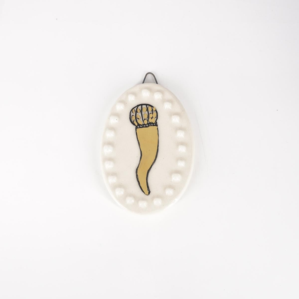 Ovalino CORNETTO fondo bianco con bollicine