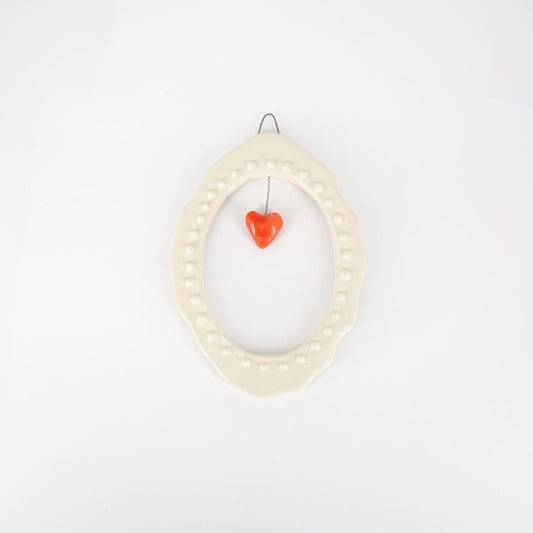 CORNICE S OVALE CUORE ROSSO BOLLICINE BIANCO