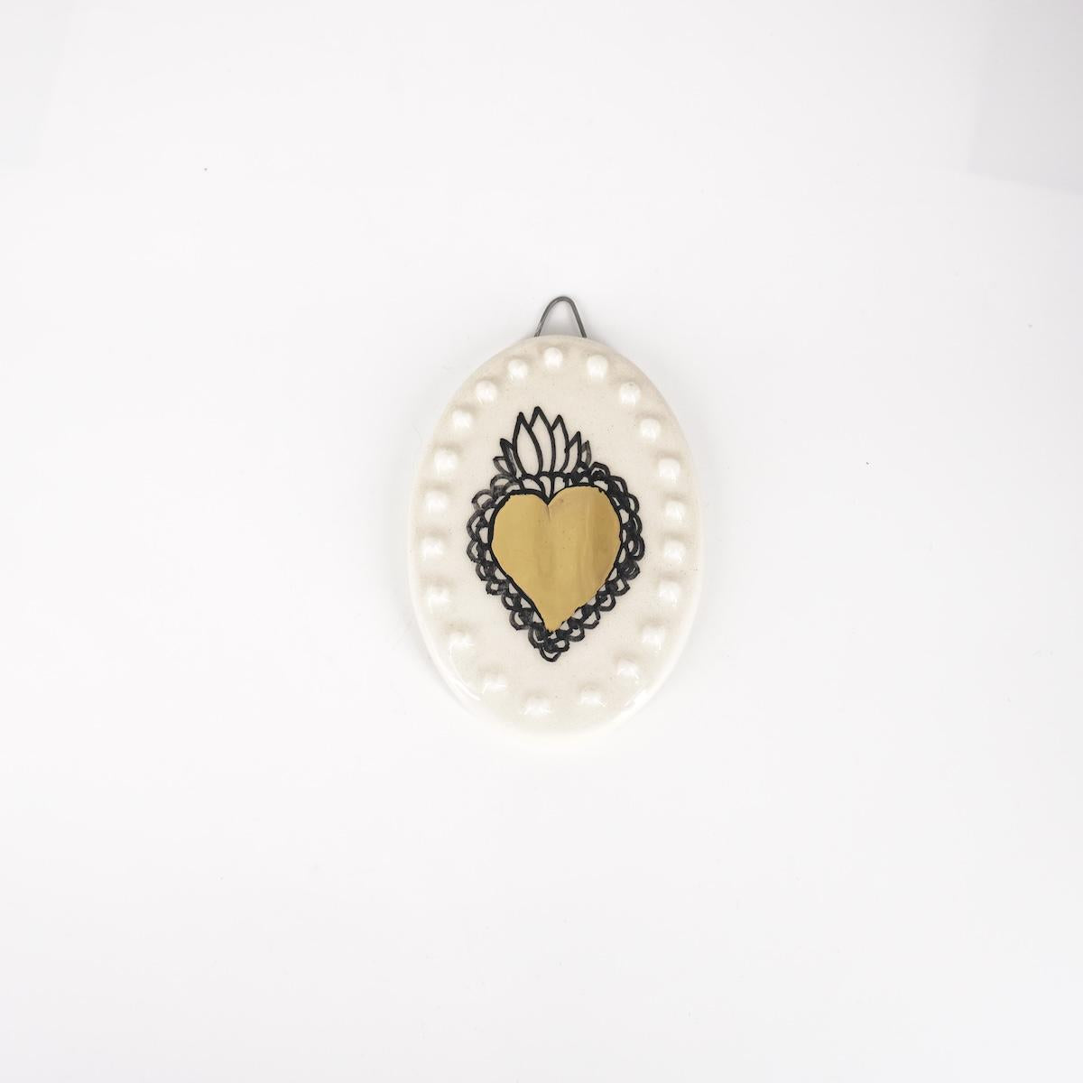 Ovalino EXVOTO fondo bianco con bollicine