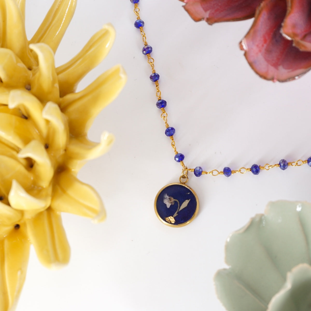 Collana fiori bottone rosario Blu COLLANA BOTTONE ROSARIO BLU ANNA FADDA 