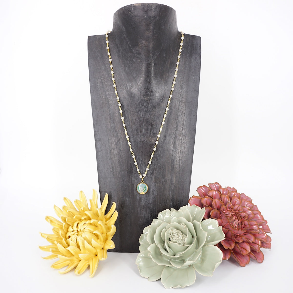 Collana fiori bottone rosario celeste COLLANA BOTTONE ROSARIO CELESTE ANNA FADDA 