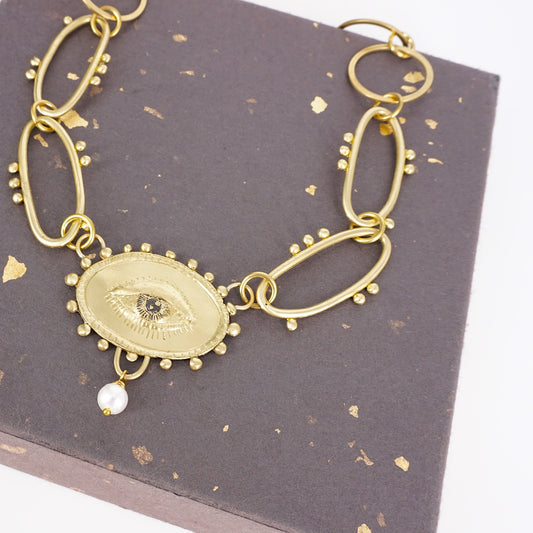 COLLANA OCCHIO CON PERLA COLLANA OCCHIO CON PERLA BIANCA  NEFELI 