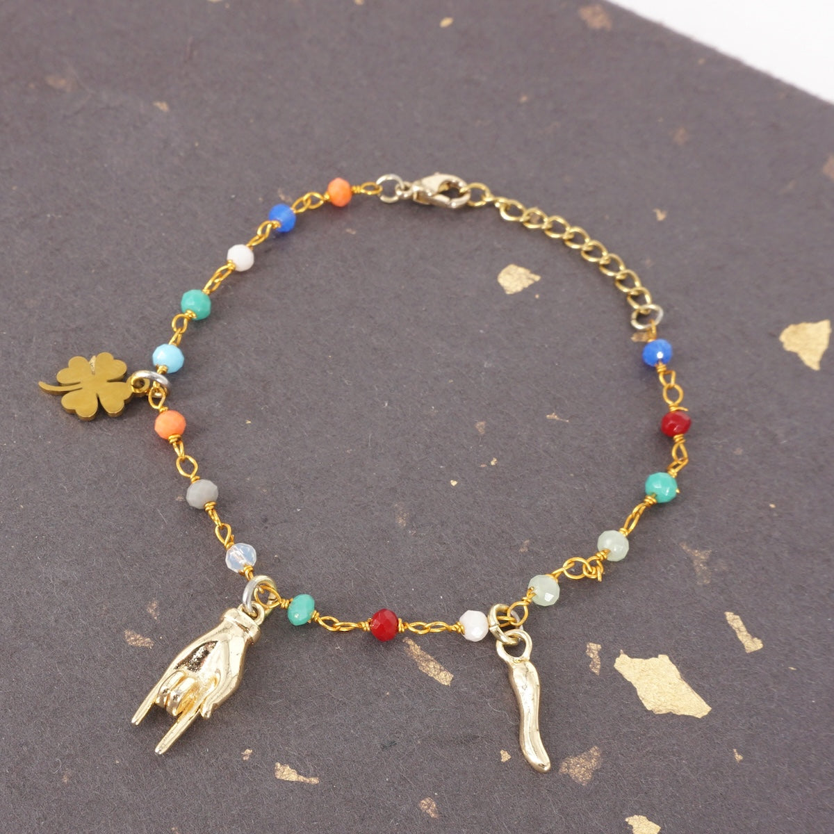 BRACCIALE ROSARIO TRE CHARM MANO TIè BRACCIALE ROSARIO TRE CHARM MANO TIÈ ORO SVEVA 