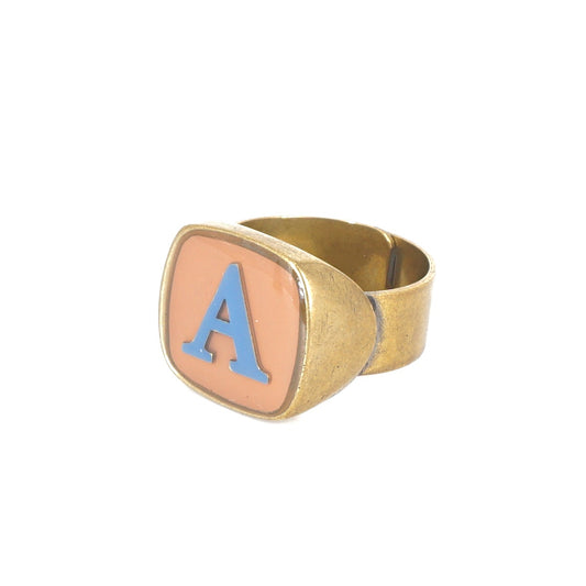 ANELLO LETTERA A NUDE E AZZURRO ANELLO LETTERA A NUDE E AZZURRO UNIQUE UNCONVENTIONAL DETAILS 