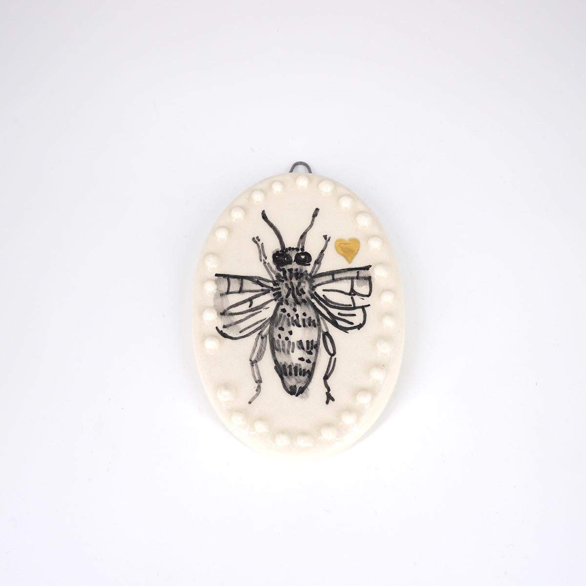 Ovalino APE cuore fondo bianco con bollicine