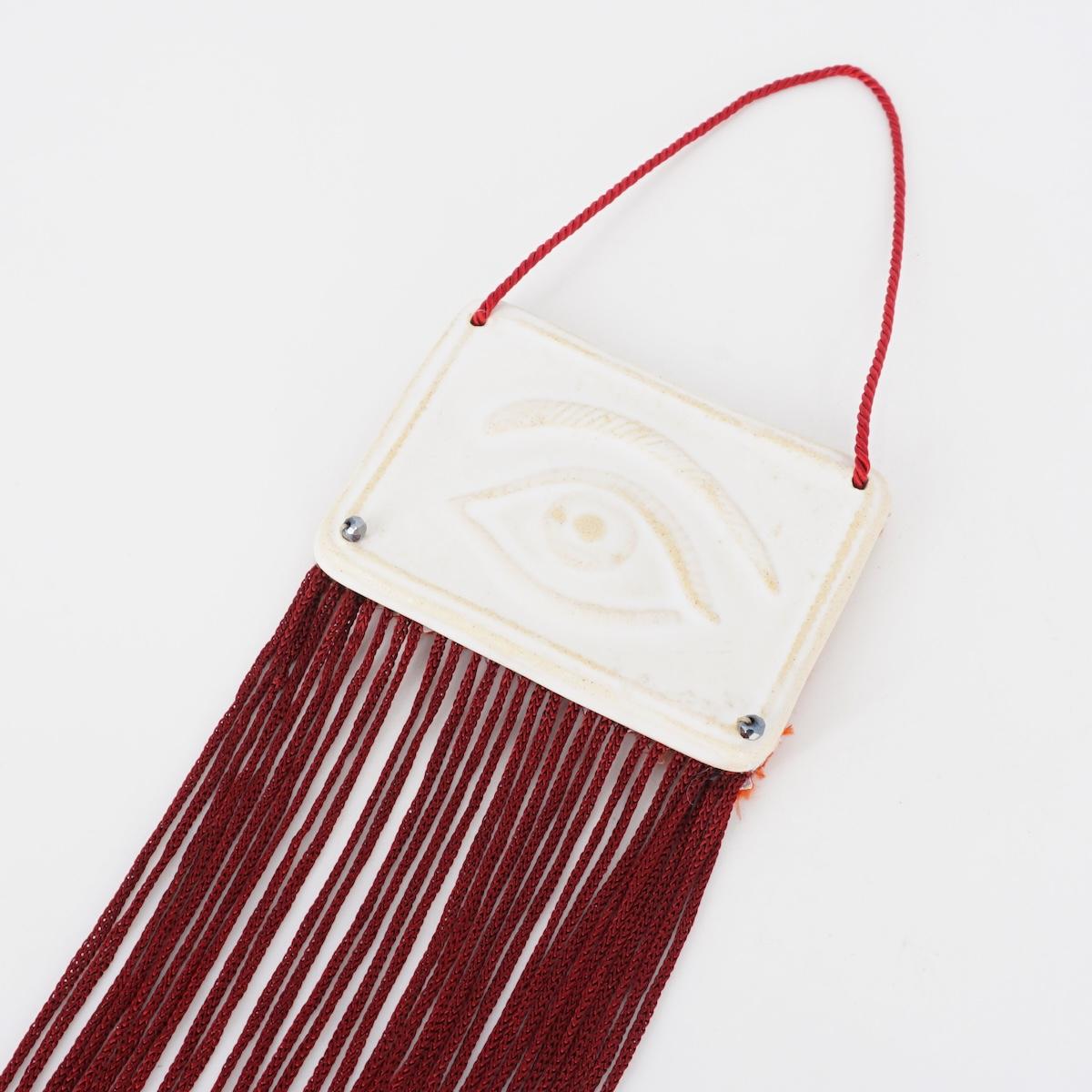 Decorazione OCCHIO con FRANGE BORDEAUX DECORAZIONE OCCHIO FRANGE BORDEAUX EIKOSITRIA 
