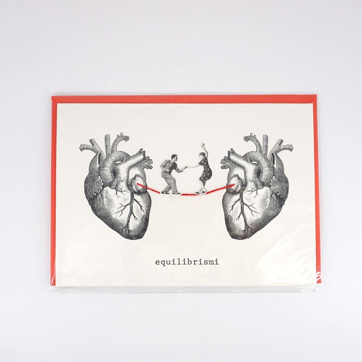Balancing card between two hearts DANCING