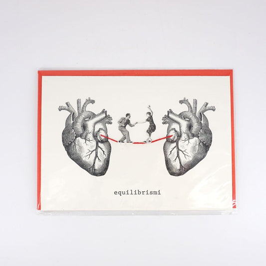 Balancing card between two hearts DANCING