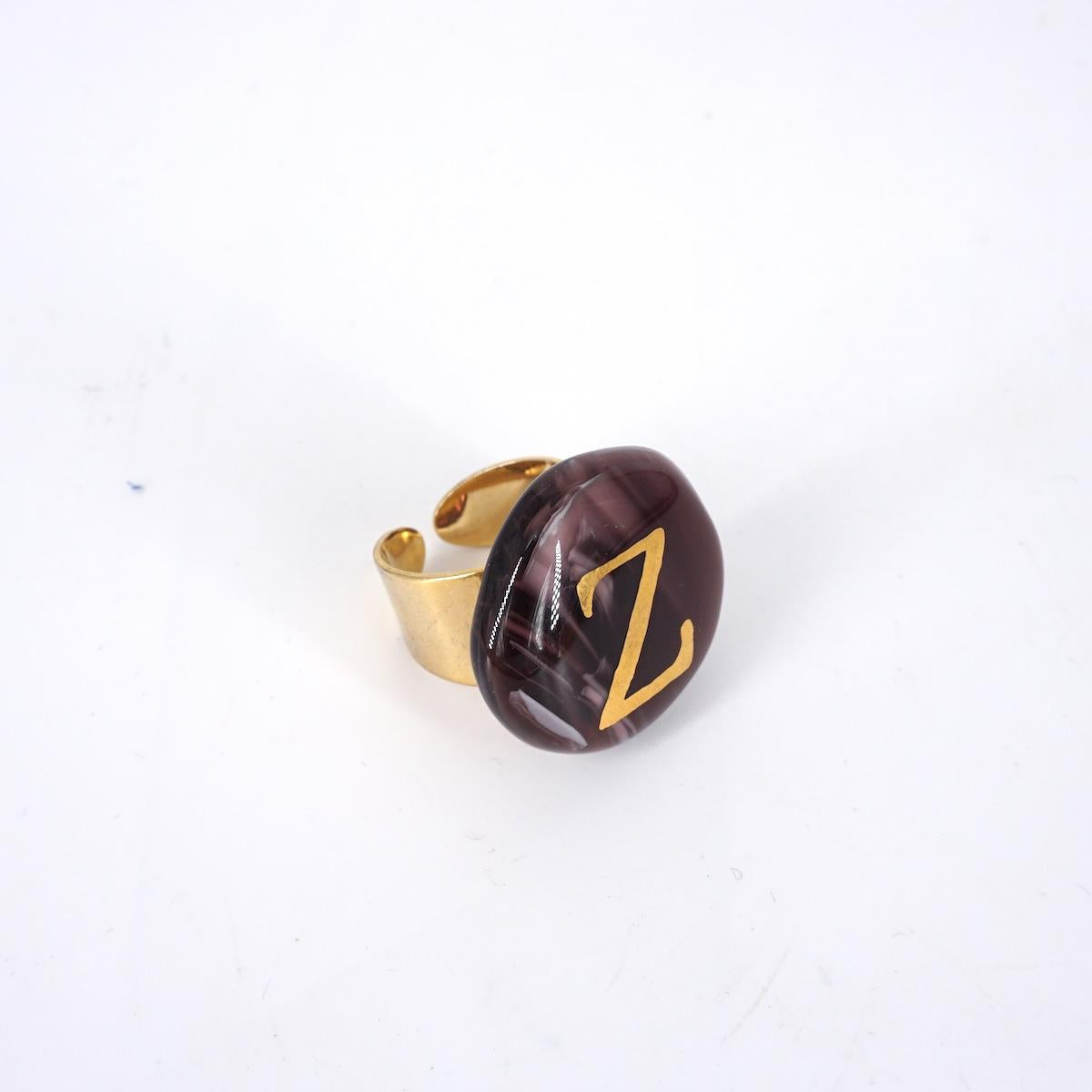 VETRO FUSO ANELLO LETTERAZ PRUGNA MARMO
