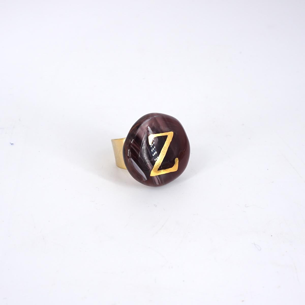 VETRO FUSO ANELLO LETTERAZ PRUGNA MARMO
